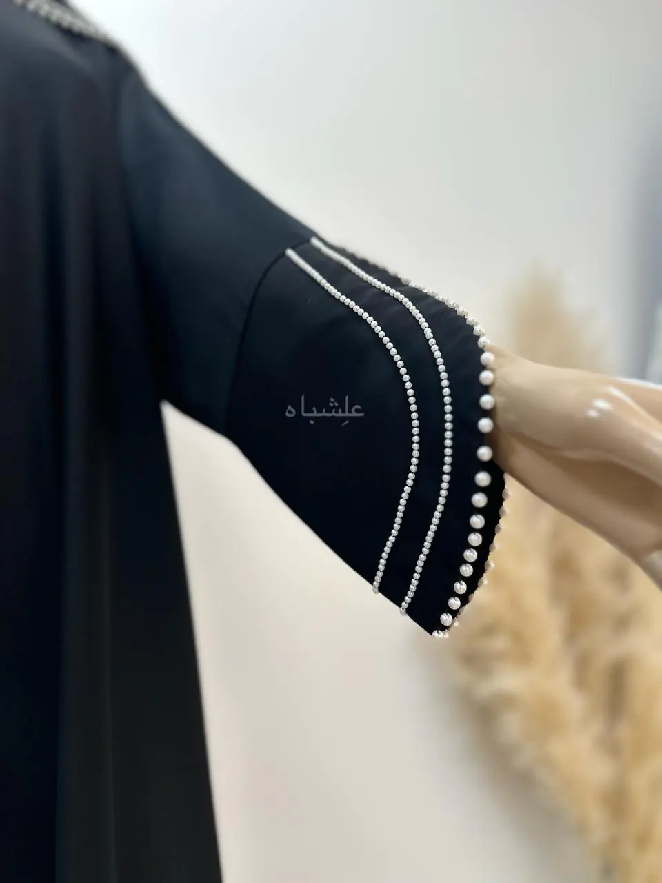 Close-up of Pearl Serenity Abaya from Alishbah, showcasing delicate pearl handwork on soft chiffon Sheila.