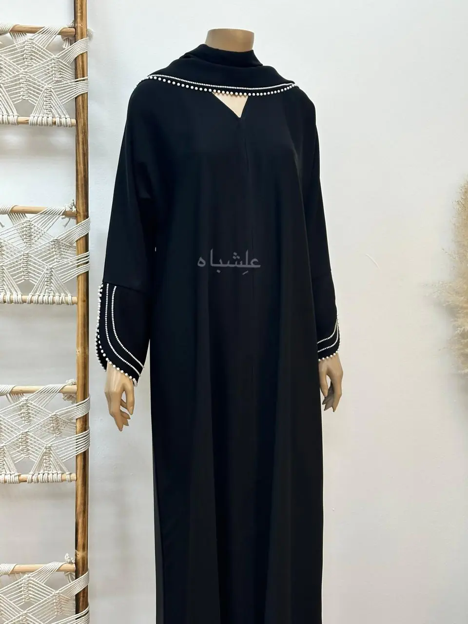 Close-up of Pearl Serenity Abaya from Alishbah, showcasing delicate pearl handwork on soft chiffon Sheila.