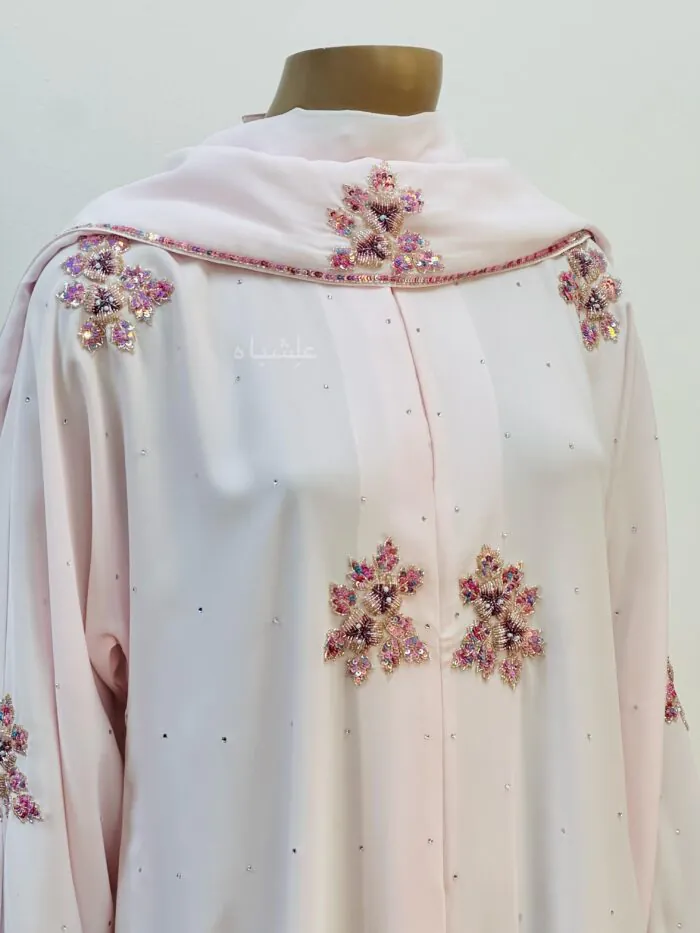 Floral hand-worked Nida fabric abaya with vibrant colors and delicate stone embellishments