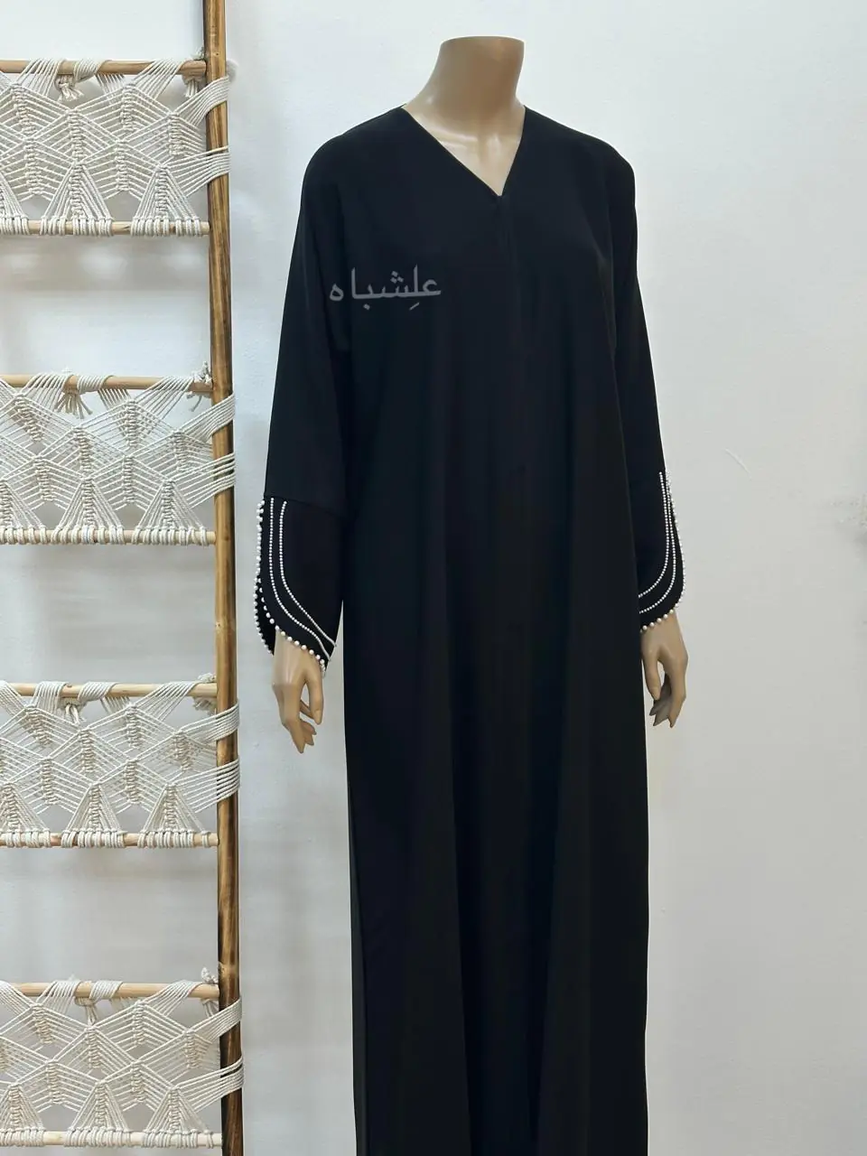 Close-up of Pearl Serenity Abaya from Alishbah, showcasing delicate pearl handwork on soft chiffon Sheila.