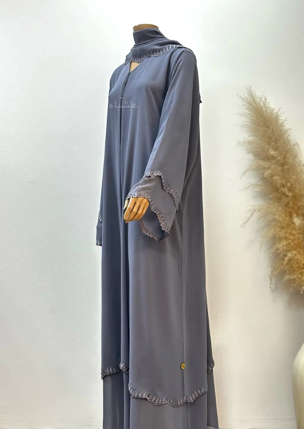 A luxurious chiffon abaya with detailed embroidery and handwork on the sleeves and bottom hem, paired with a matching soft chiffon Sheila for a refined look.