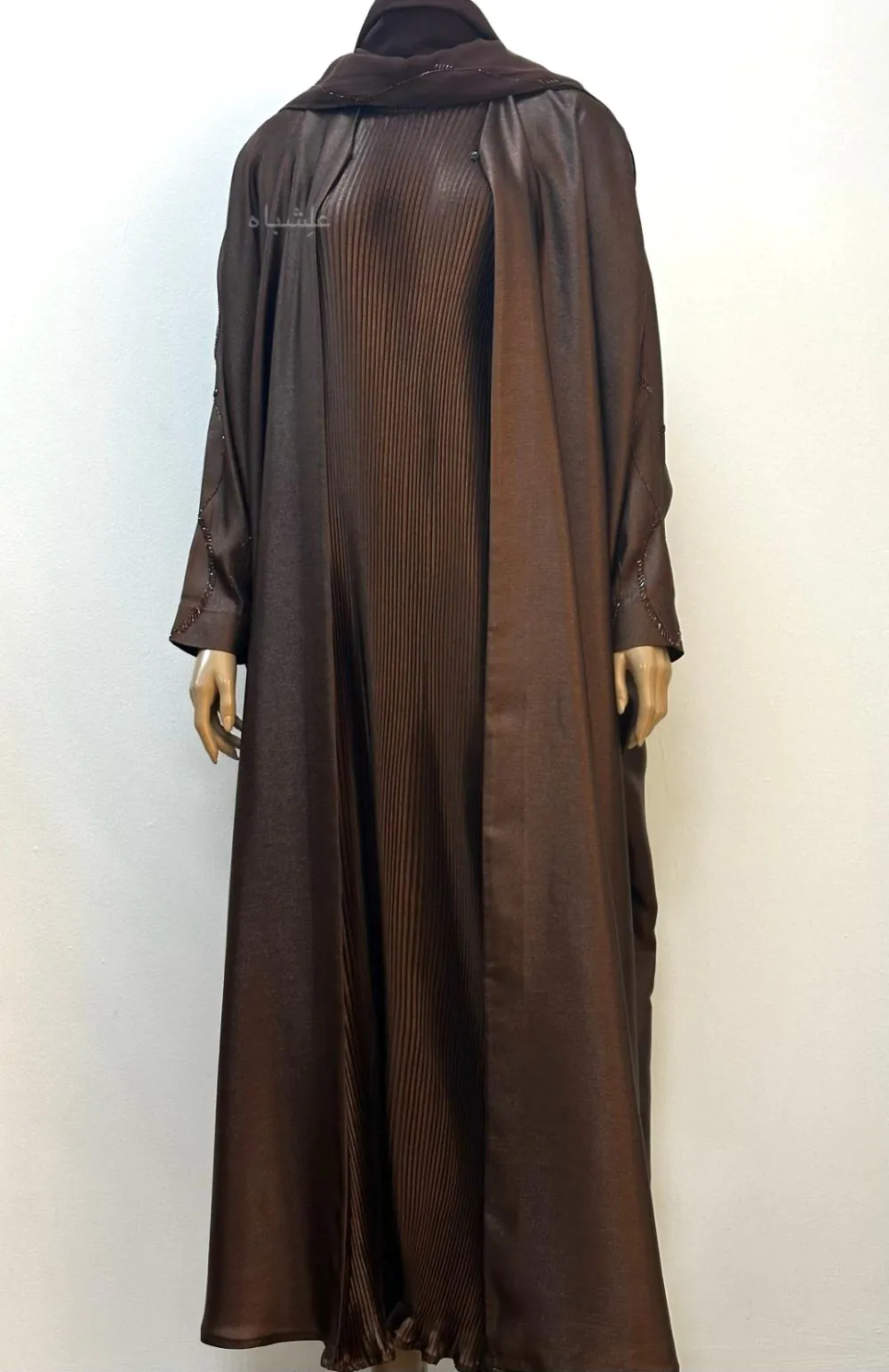 Front view of the Marya Satin Flow Abaya set, featuring a luxurious satin abaya with handworked sleeves, a custom pleated inner dress, and a soft chiffon sheila.