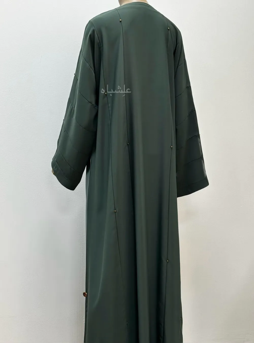 Back view of Nida Premium Green Handwork Abaya featuring intricate metal beads handwork, crafted from high-quality Nida fabric, designed for elegant and versatile wear.