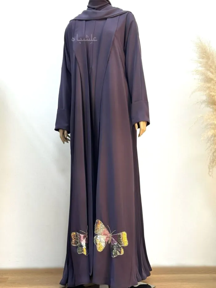 Full view of Twilight Butterfly Abaya in deep purple Nida Premium fabric, featuring butterfly handwork on the lower front and pleated sides, displayed on a mannequin from Alishbah collection