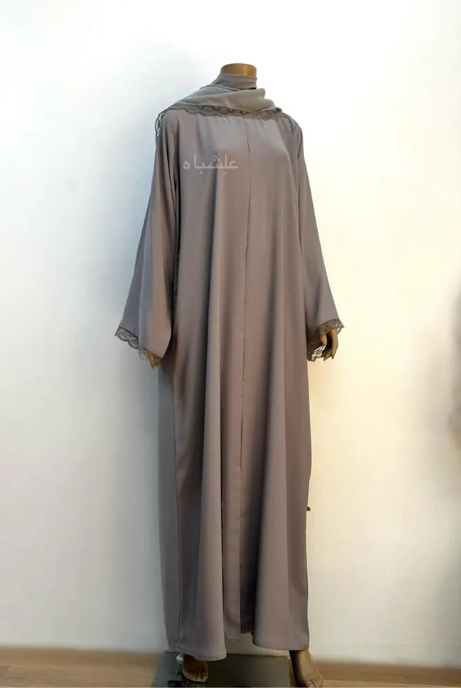 "Front full view of the Lace Whisper Abaya with Sheila draped, highlighting lace-trimmed sleeves and soft chiffon fabric."