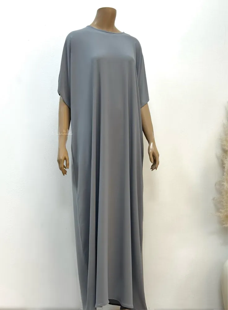 Front view of the inner abaya, showcasing its simple and smooth design crafted from soft, high-quality fabric.