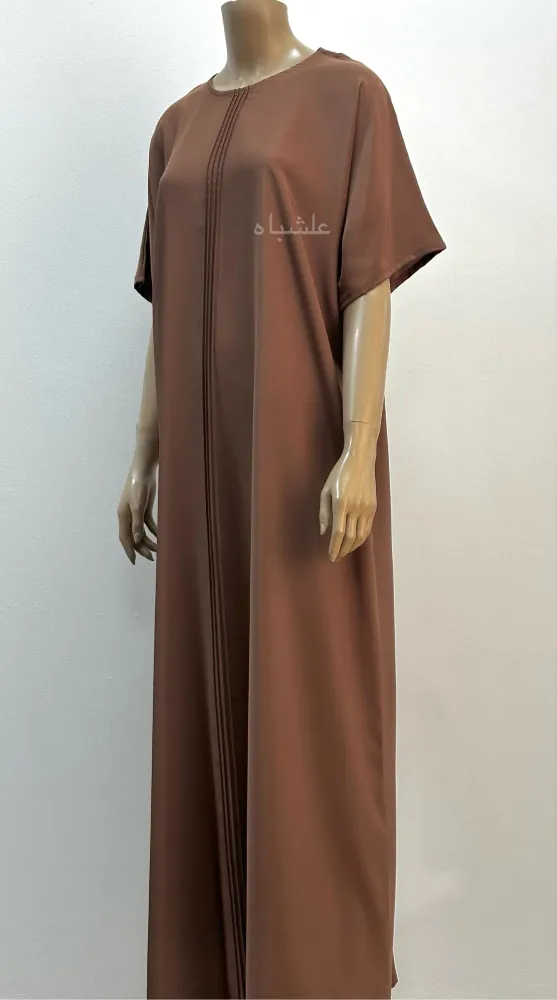 "Full view of the inner dress of the Radiant Harmony Abaya, showcasing pintuck details and a sleek two-tone design."